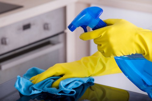 Team member applying health and safety standards during cleaning work