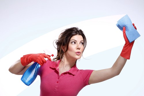 Professional cleaning team following insurance and safety procedures